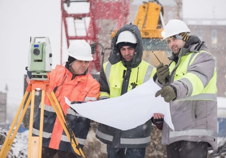Civil Engineers At Construction Site In Winter